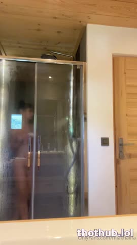 Mia Khalifa standing showering naked