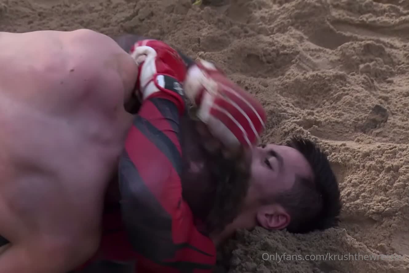 Hot Russian men brawling in tight gear in a sand pit.